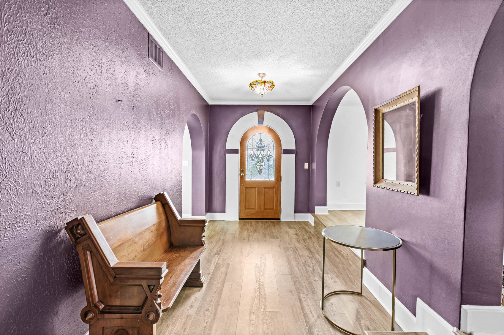 inside front door with purple hallway